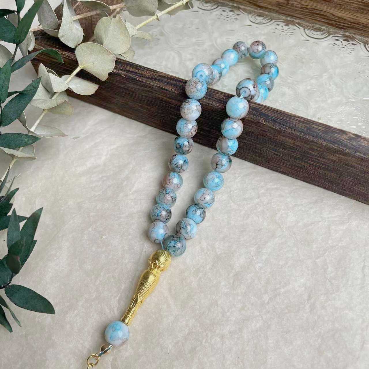 33-piece Gold Tassel Glass Bracelet With 10mm Large Flower Beads 📿                                                               . 33-delige gouden armband met kwastjes en glazen kralen, inclusief grote bloemkralen van 10 mm📿